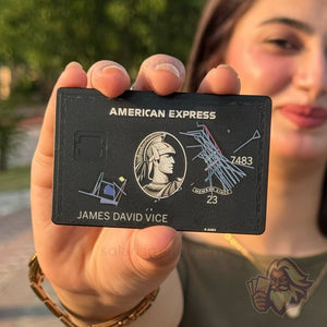 Matte-black Solaris metal card with custom art engraving, front view