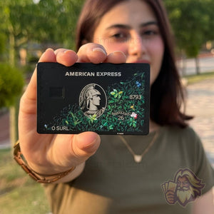 Matte-black Solaris metal card with floral engraving, front view