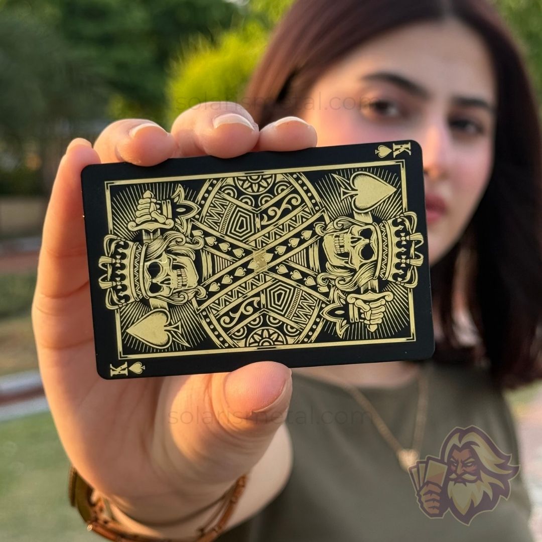 Solaris metal card with an engraved king design, front view